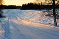 Country road winding through snowy winter landscape Royalty Free Stock Photo