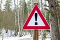 Road sign triangular shape with exclamation mark. Red attention traffic sign.