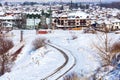 Winter road, houses with snow roofs panorama in bulgarian ski resort Bansko Royalty Free Stock Photo