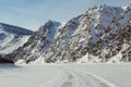 Winter road on ice mountain river. Royalty Free Stock Photo