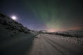 Winter road with northern light Royalty Free Stock Photo