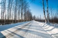 Winter road in the russian forest in a clear sunny day Royalty Free Stock Photo