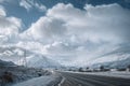 Winter road through Scottish Highlands and snowy mountains Royalty Free Stock Photo