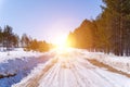 Winter road snowy road in forest in sunny day.