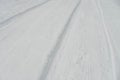 Winter Road with Tire Tracks in Fresh Snow Royalty Free Stock Photo