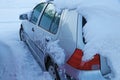 Winter in road traffic. A car full of snow and ice Royalty Free Stock Photo