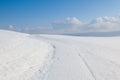 Winter road under blue sky Royalty Free Stock Photo