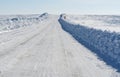 Winter road under blue sky Royalty Free Stock Photo