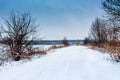 Winter road on which the bus rides. Winter landscape with road and trees_ Royalty Free Stock Photo