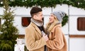 Winter Romance. Happy young couple embracing outdoors ar campsite, having romantic moments Royalty Free Stock Photo