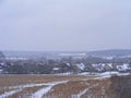 Winter rural landscape. Russian village. Farm field scene Royalty Free Stock Photo