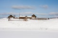 Winter rural landscape on the shore of the frozen river