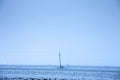 Winter rural landscape, a snowy agricultural field covered with snow and ice and power lines of electricity Royalty Free Stock Photo