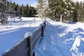 Winter rural landscape with wooden fence covered with hoarfrost Royalty Free Stock Photo