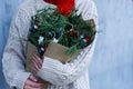 Winter rustic bouquet with fir branches. Female hands holding a Christmas bouquet. New year Royalty Free Stock Photo