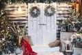Winter rustic interior decorated for New year with artificial snow and Christmas tree. Winter exterior of a country