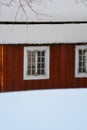 Fresh snow giving a mantle to a beautiful playhouse and trees in the garden