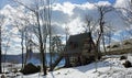 Winter`s Tale. Fairy house of a witch on chicken legs. Sunny day in the park.