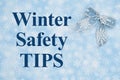 Winter Safety Tips message with a blue bow with white snowflake on blue snowflakes