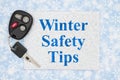 Winter Safety Tips on silver card with car key on blue and white snowflakes