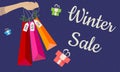 Banner Sale multicolored shopping bags in hand