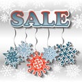 Winter sale background with bright snowflakes