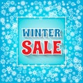 Winter Sale banner. Snowflakes and Winter Sale phrase on blue ba