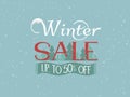 Winter sale banner vector design. Discount text 50 percent with snowflakes and trees on blue background Royalty Free Stock Photo