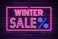 Winter sale discount sign glowing purple violet neon text on brick wall