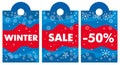 Winter sale and discounts. Stylized snowflakes and lettering on a red and blue background