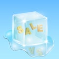 Winter sale. Frozen text inside the ice cube. Water and drops everywhere
