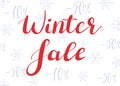 Winter sale. Lettering on the background of snowflakes and discounts