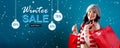 Winter sale message with woman holding shopping bags