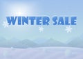 Winter sale words on the beautiful Chrismas winter landscape background.