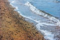 A winter scene of the bay and Sandy shoreline and waves at ebbtide