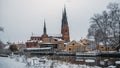 Winter scene of the beautiful city of with a Cathedral of Uppsala near the lake in Sweden Royalty Free Stock Photo