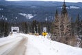 Winter scene of a bridge crossing the Bow River on the snow covered, icy Bow Valley Parkway in Banff National Park Canada Royalty Free Stock Photo