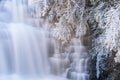 Winter scene of the Desoto Falls cascading over a rocky outcrop in a frosty forest, Alabama Royalty Free Stock Photo