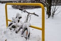 Winter scene featuring a bicycle partially covered by a blanket of fresh snow Royalty Free Stock Photo