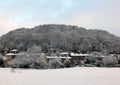 Winter scene in hebden bridge with houses with snow covered roofs on the houses and frozen trees Royalty Free Stock Photo