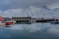 Winter Scene in Iceland small town Siglufjordur with water refl