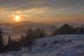 Winter scene with mountains, trees, sunset and snow Royalty Free Stock Photo