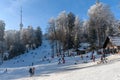 Winter scene with people enjoying in winter activities on sledding hill at Sljeme, Croatia Royalty Free Stock Photo