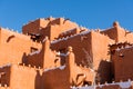 Winter scene of snow-covered adobe building in Santa Fe, New Mexico