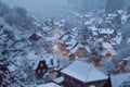 Winter scene of a snowy town with numerous houses and trees covered in fresh snow, A blanket of fresh snow covering rooftops and