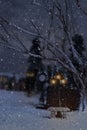 Winter scene with stone bench and street lamps Royalty Free Stock Photo