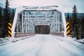 Winter scene of a tresle bridge crossing the Bow River on the Bow Valley Parkway in Banff National Park Canada Royalty Free Stock Photo