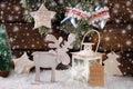 Winter scene with wooden reindeer and lantern for christmas Royalty Free Stock Photo