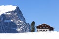 Winter scenery in the Austrian Alps, wooden chalet in the snow