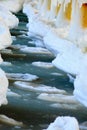 Winter scenery. Baltic Sea. Close up ice formations icicles on pier poles Royalty Free Stock Photo